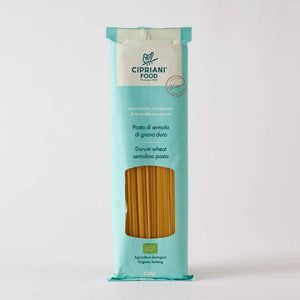A blue package of organic cipriani spaghetti on a white background